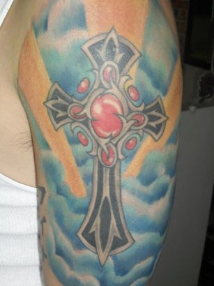 The Cross Tattoo Inked On Arm